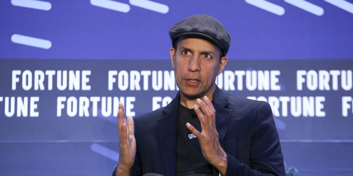 Glean CEO argues AI will augment rather than replace workers, contrasting with other executives who warn of job losses