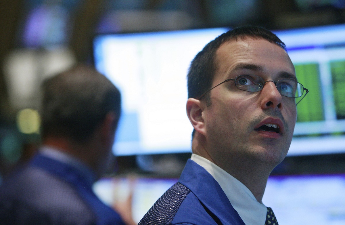 Analysts warn that excessive investor enthusiasm for AI could trigger a market correction similar to past tech bubbles, with four key warning signs emerging.